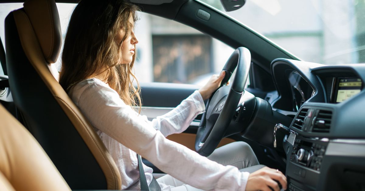 woman driving while keeping car safe