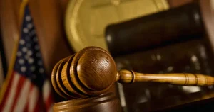 Image of a gavel in a courtroom